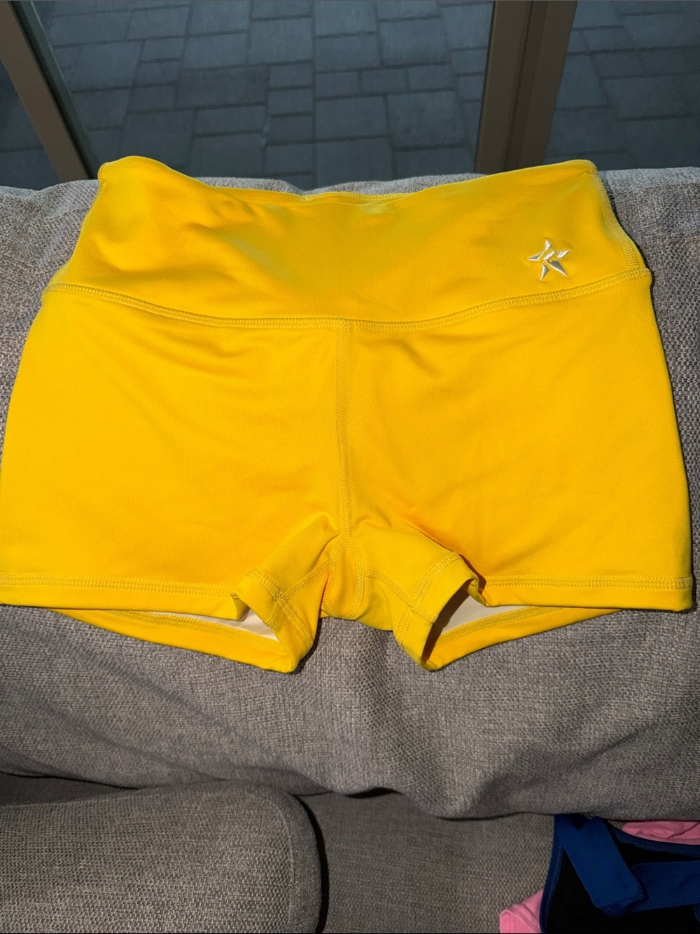 Rebel Athletic Yellow Shorts with Subtle Star Logo